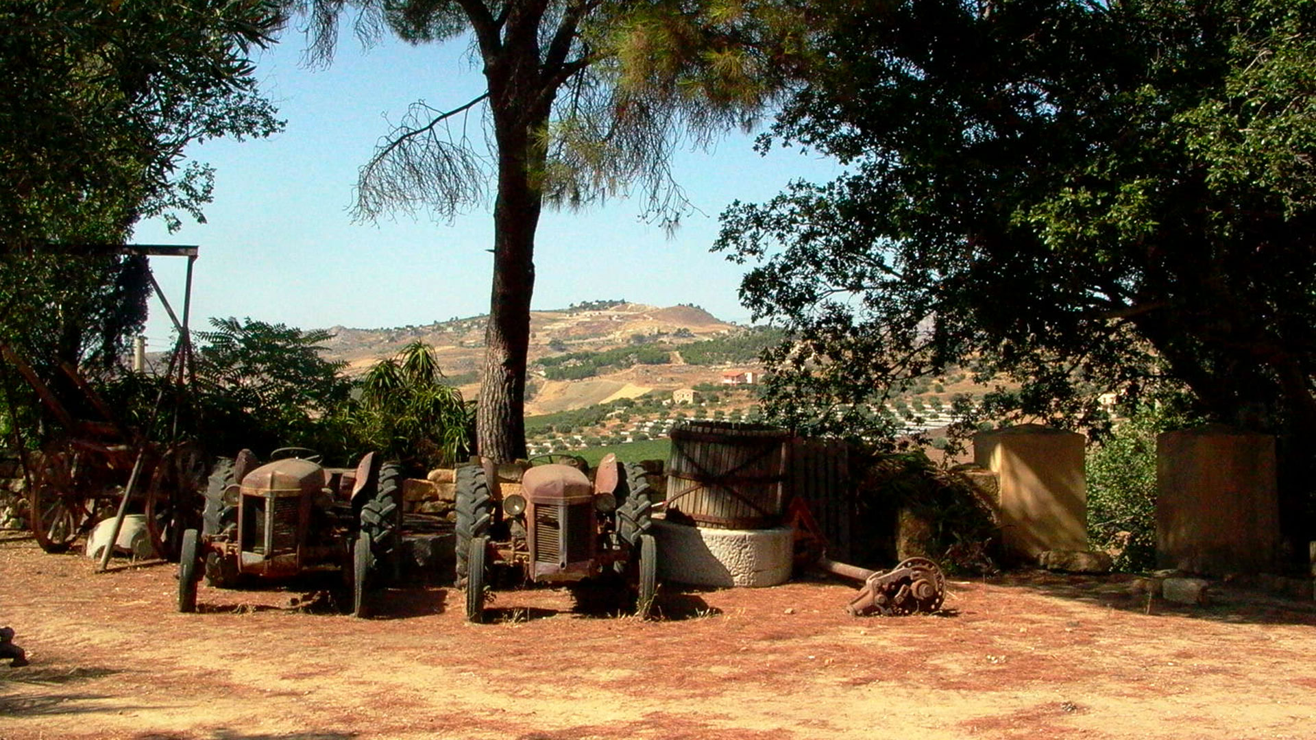 The garden at Fattoria Mose with vintage agricultural equipment